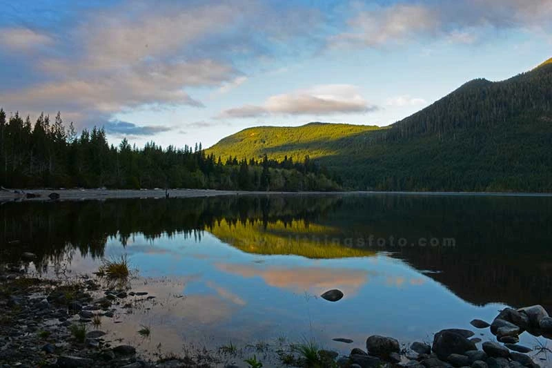 This mountain lake sunrise photo shows how post processing can enhance the vibrancy of an image and increase depth by enhancing the light and shadows.