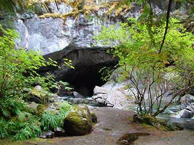 photo of Little Huson Cave entrance with the trail to it being the leading line.