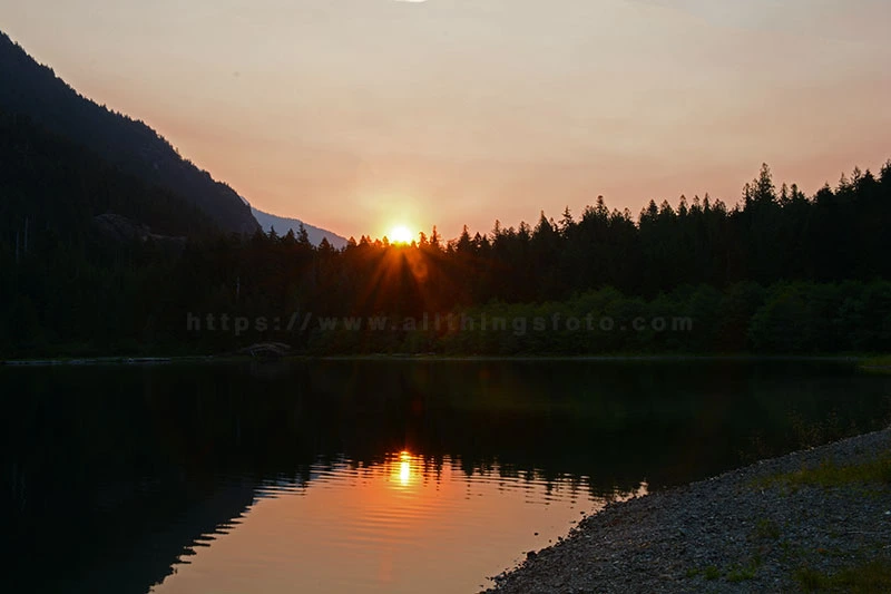 photo of how the golden hour colors paint the sky over Drum Lake one morning