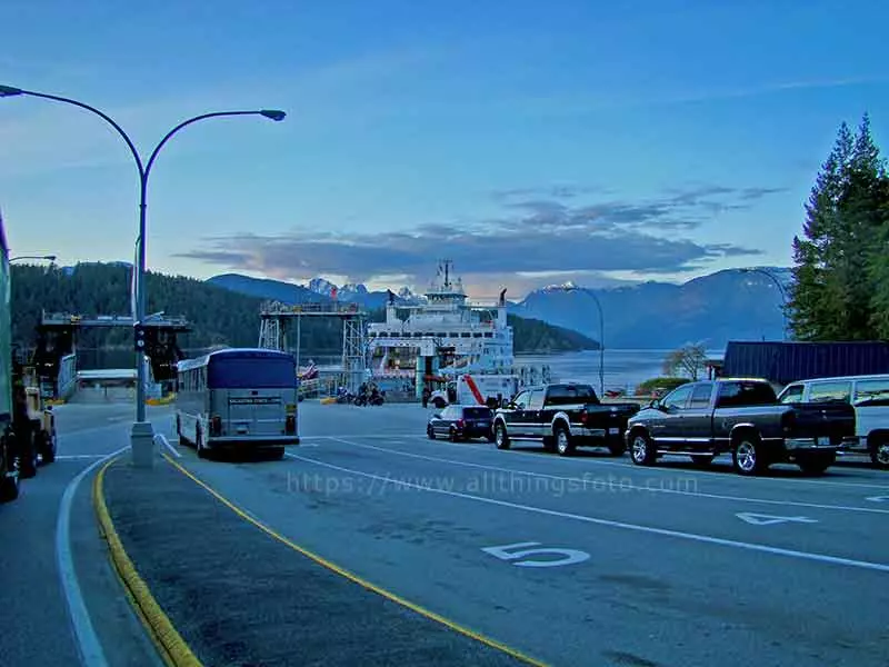 photo of the parking lot at the Horseshoe Bay Ferry Terminal using the lane lines to lead the view to the ferry.