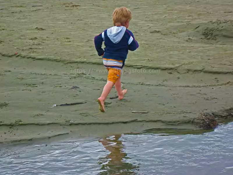 photo of my nephew running along the beach