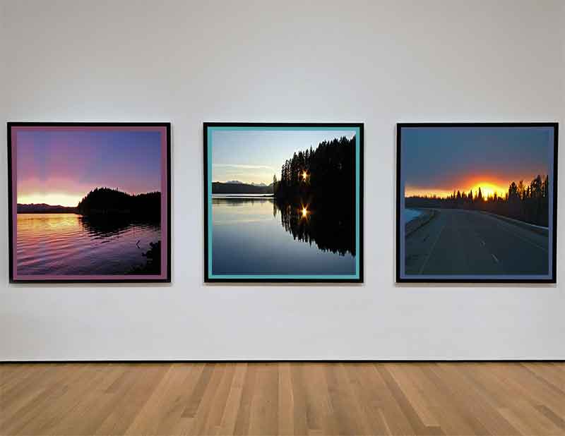 photo of a gallery wall with metal picture frames hanging on it for perspective